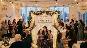 A warm family-centered community event in NYC with elegant custom banners, a welcoming backdrop for family photos